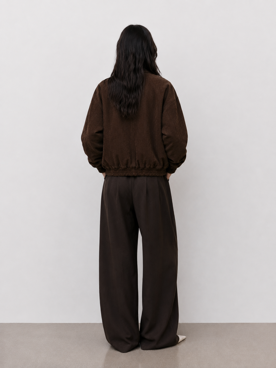 The Dark Chocolate Suede Bomber — model back view