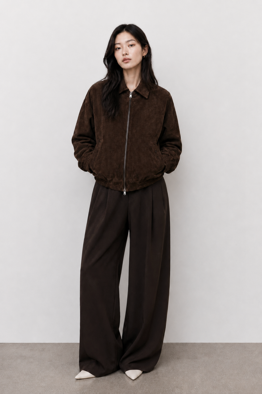 The Dark Chocolate Suede Bomber — model front view